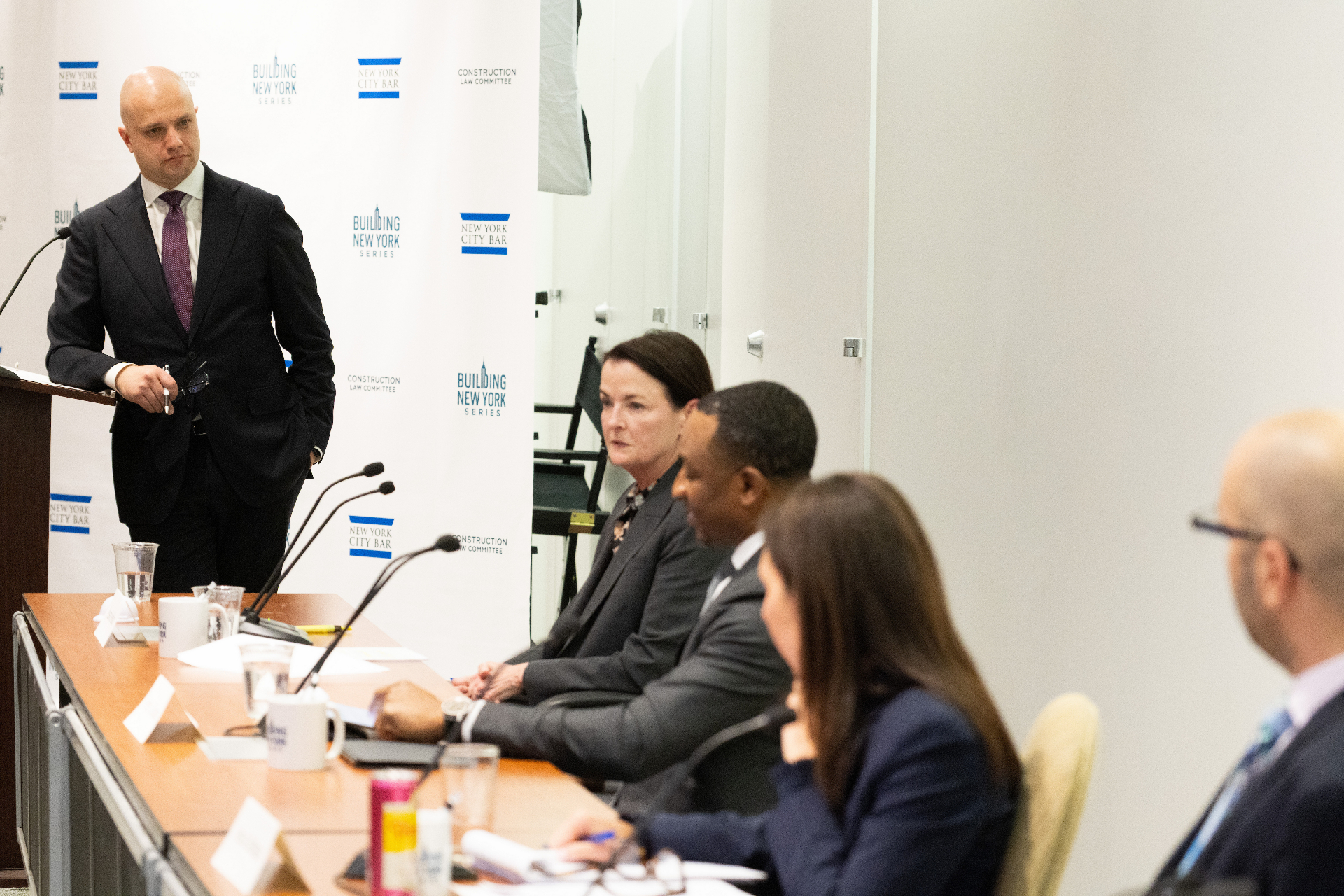 Susan Jenkins speaking from the panel table during the airport development discussion