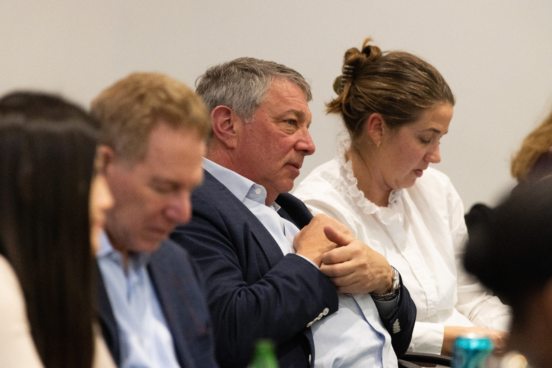 Attendees listening attentively from the audience during the airport development panel