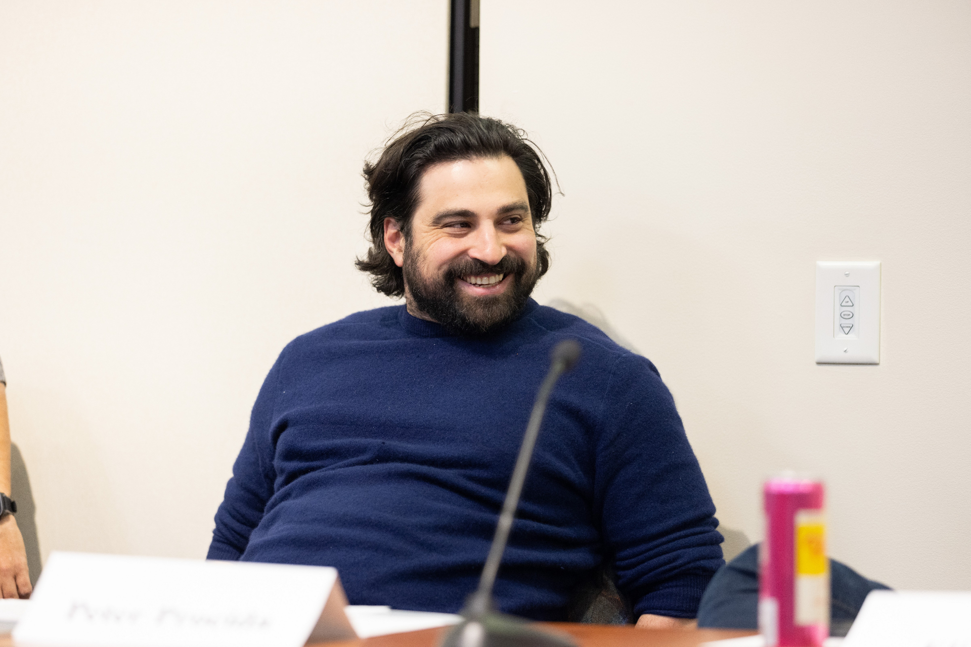 Peter Procida seated at the panel during the discussion