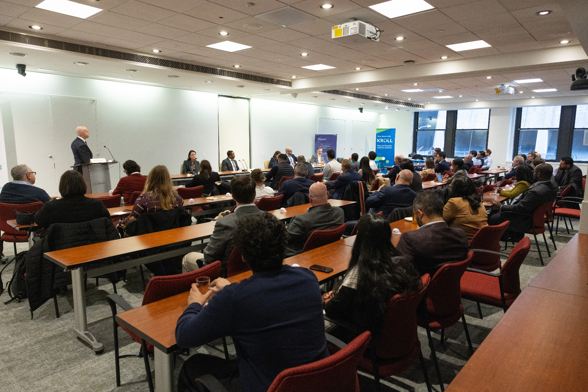 Wide view of the audience and panelists during the airport development event at the NYC Bar Association