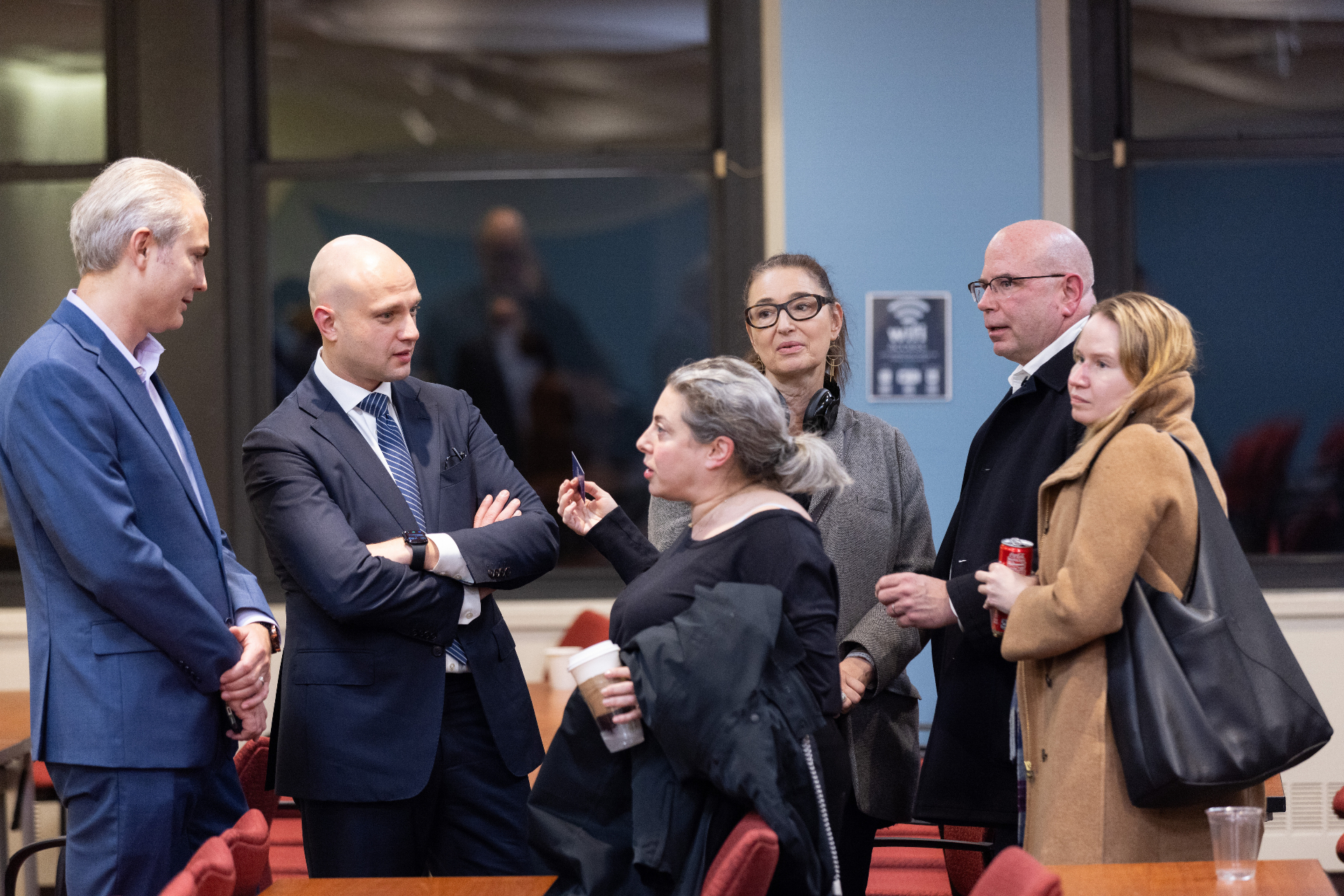 Max Rayetsky in a group discussion with attendees following the panel