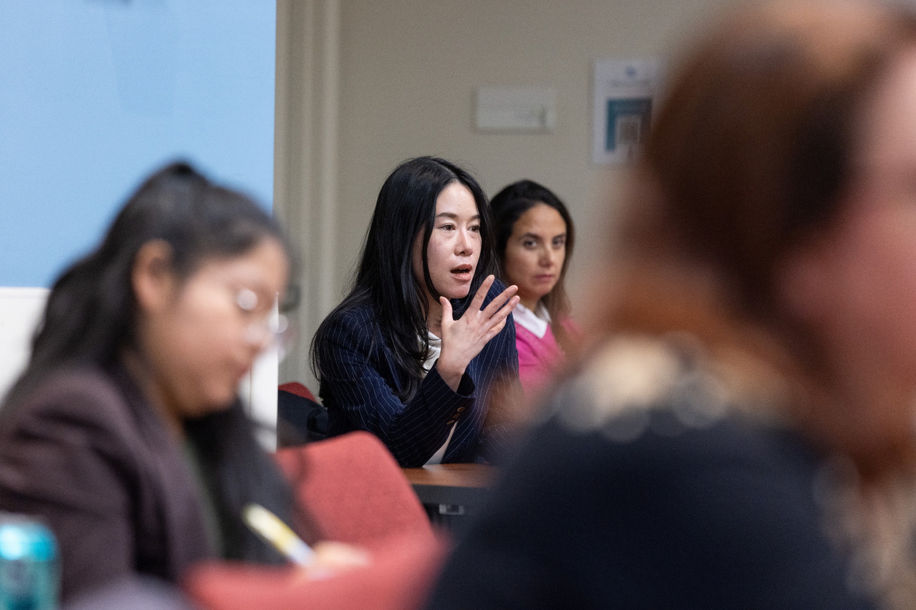 An attendee posing a question to the panel during Q&A